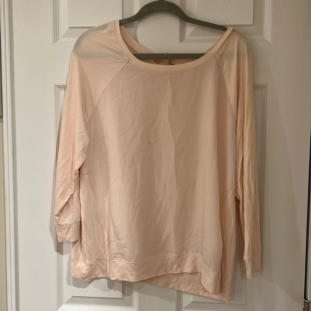 Pink top ,silky material .Gently used